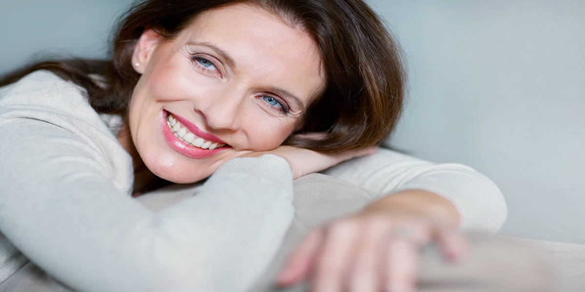 woman smiling after dental implants toronto - Markham Dentists at Compleo at Dentistry at Vitality Health